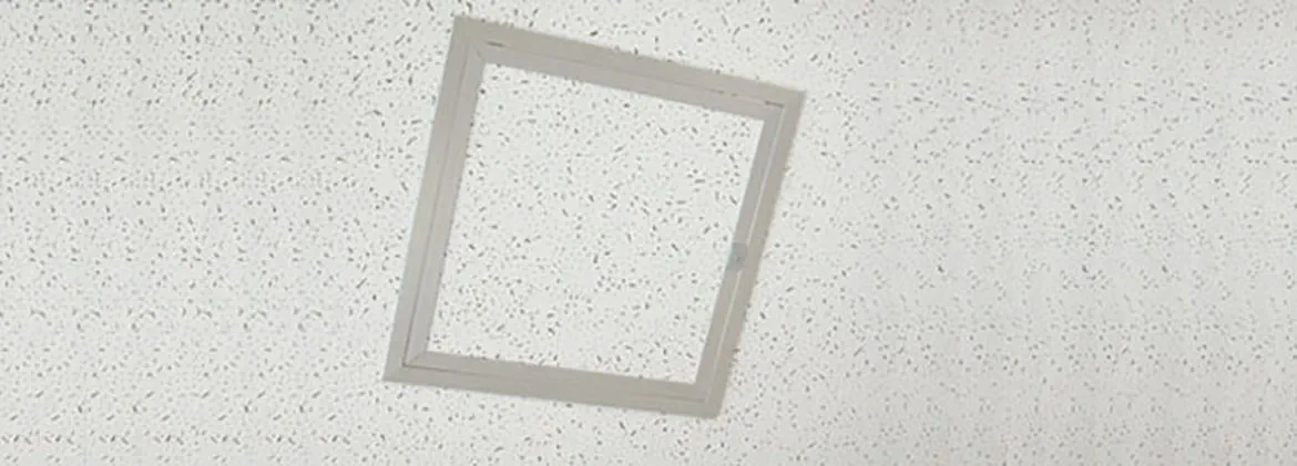 Concealed access panel set into a ceiling