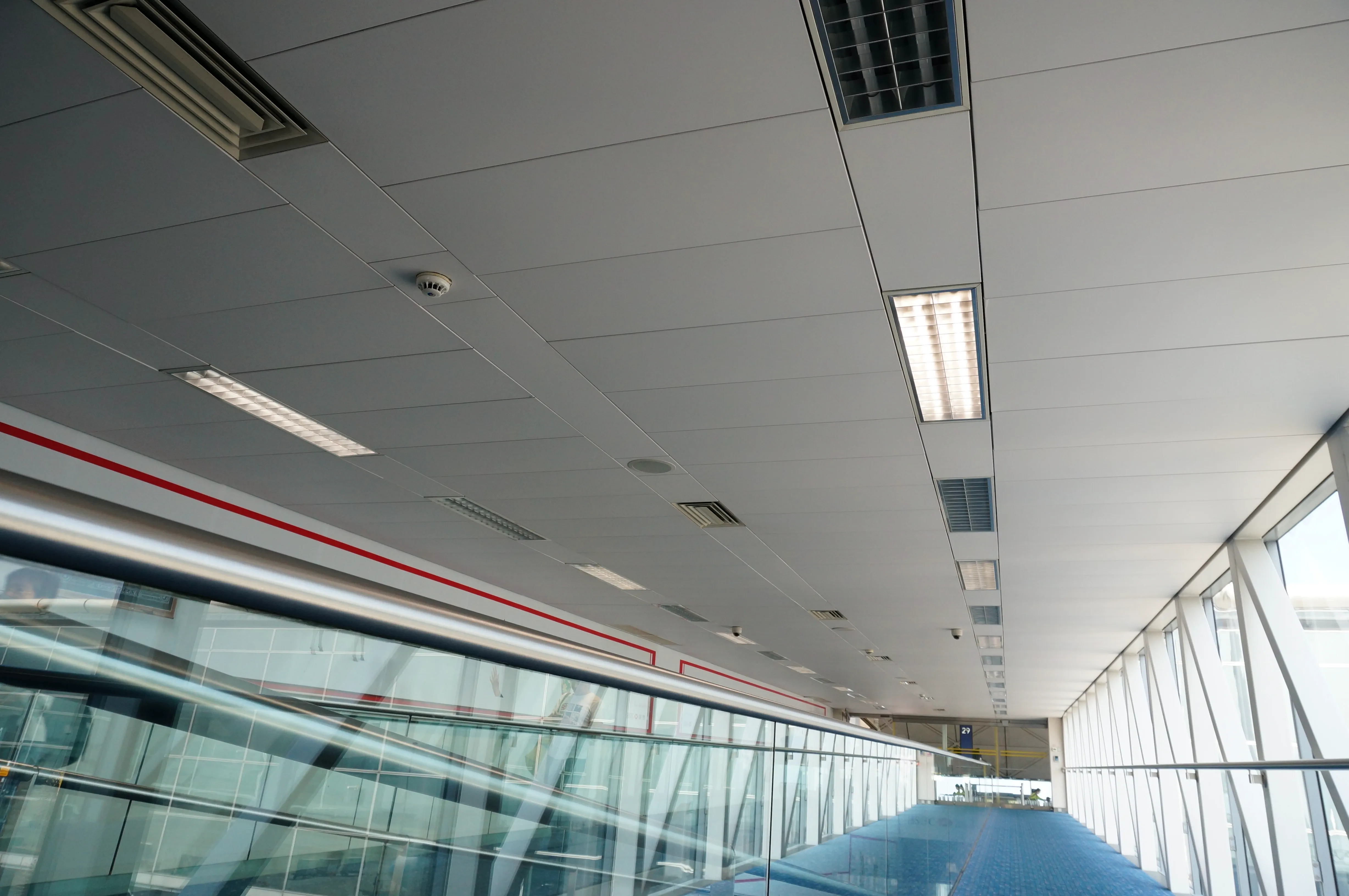 Hong Kong Airport Terminal 2 concourse with a suspended ceiling system