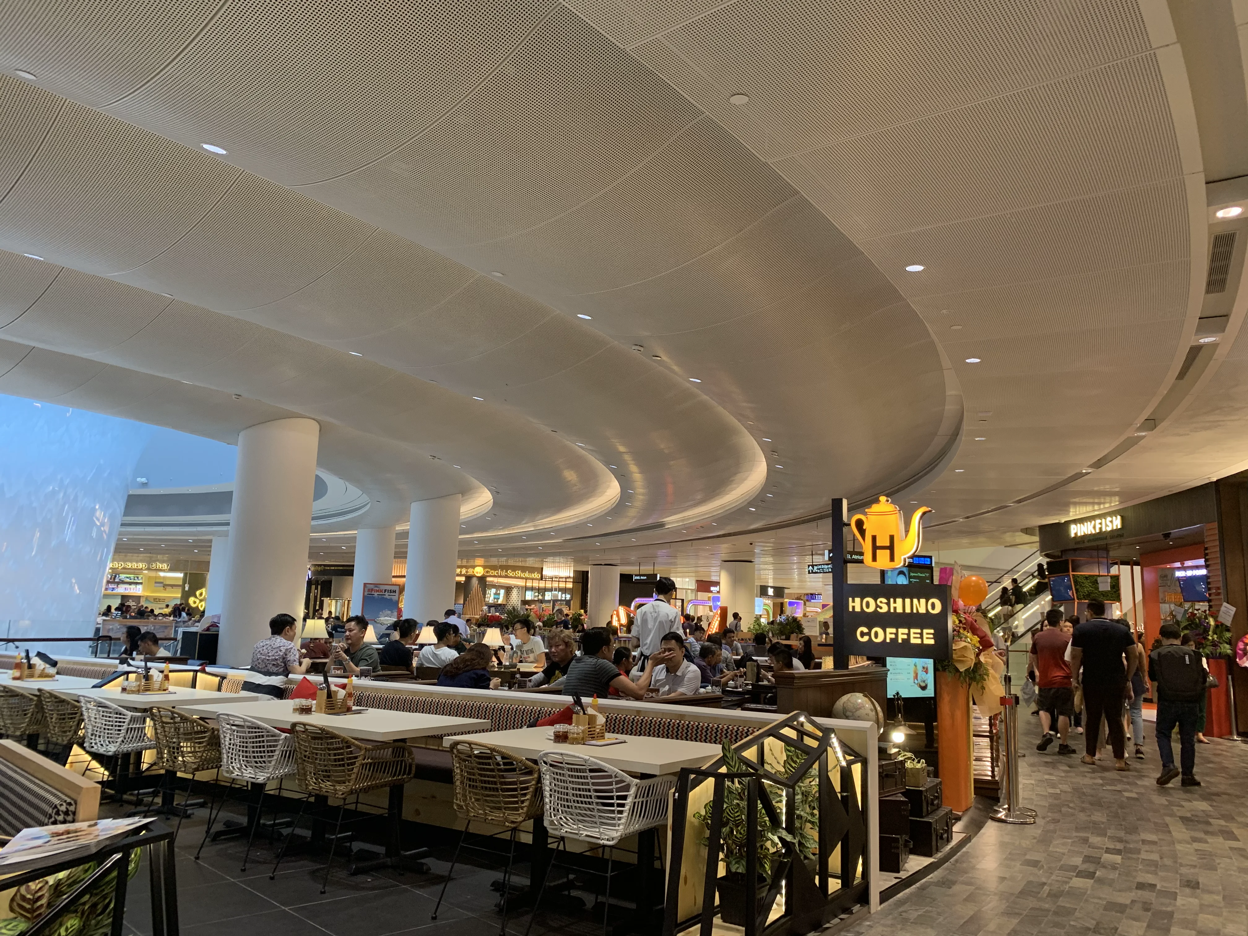 Singapore Changi Airport interior with a curved ceiling system